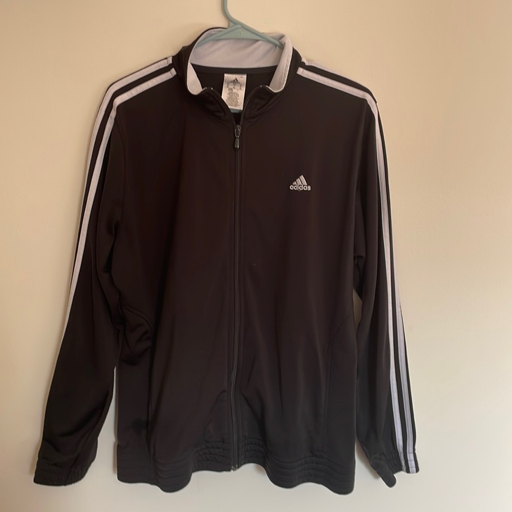 Adidas Black Jacket with lining of 3 white stripes going down the sleeve
